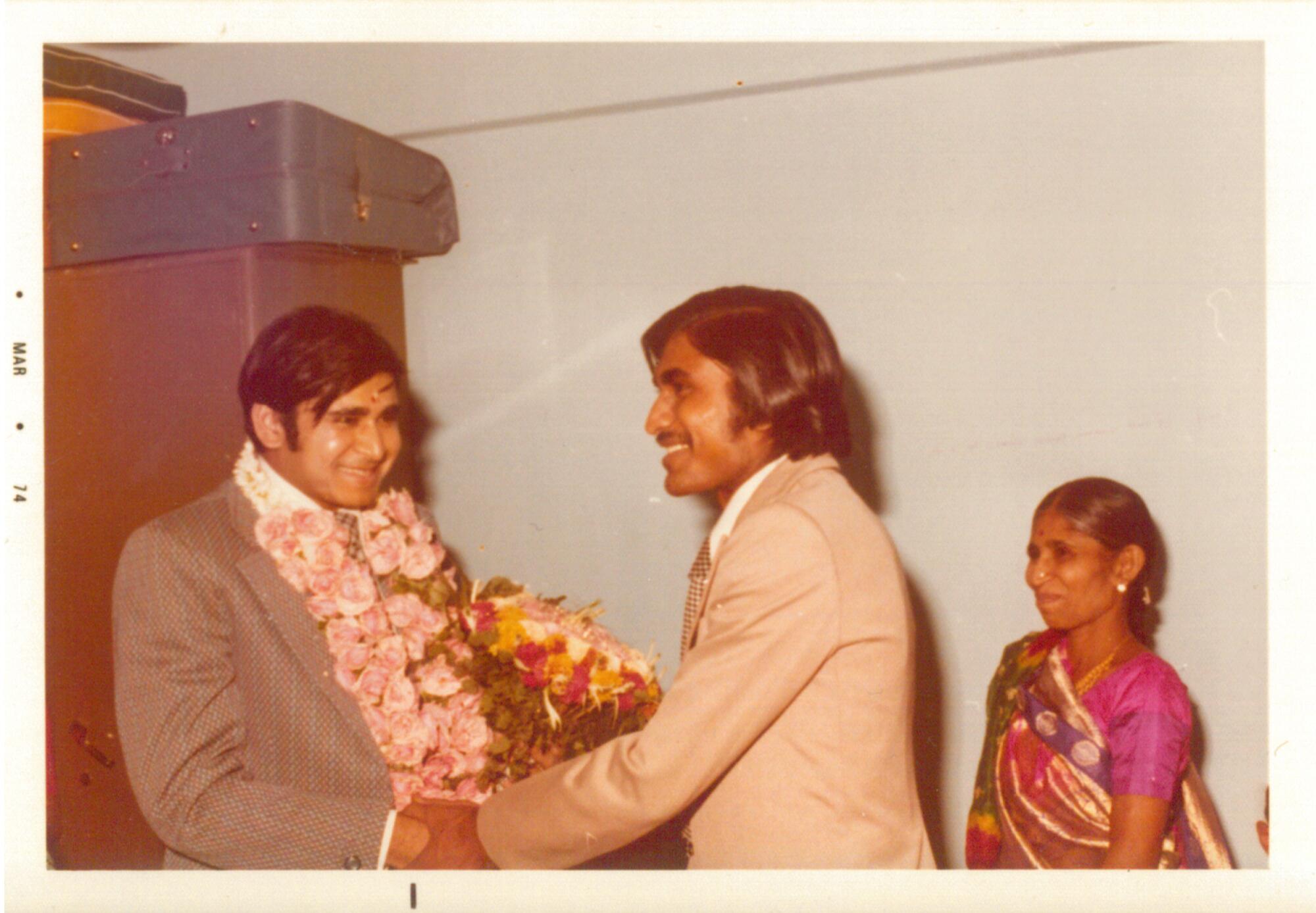 Shashikant Jogani, left, shakes hands with Haresh Jogani. 