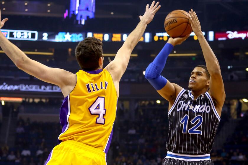 Forward Tobias Harris, pulling up for a shot over Lakers forward Ryan Kelly, will be one of eight players under age 25 for the Magic next season.