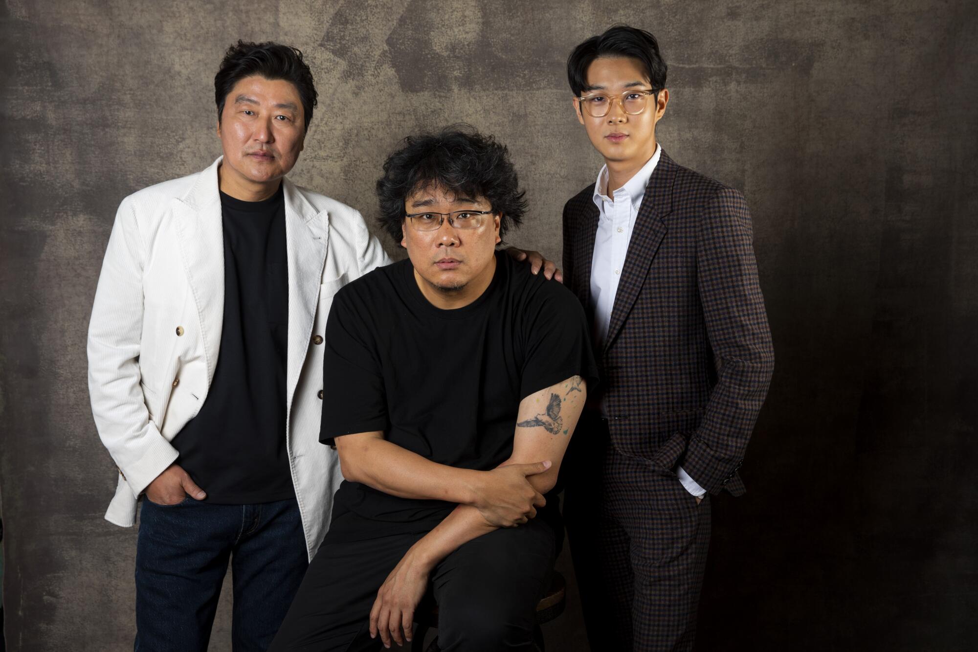 Actor Choi Woo Shik, director Bong Joon-Ho and actor Song Kang-Ho