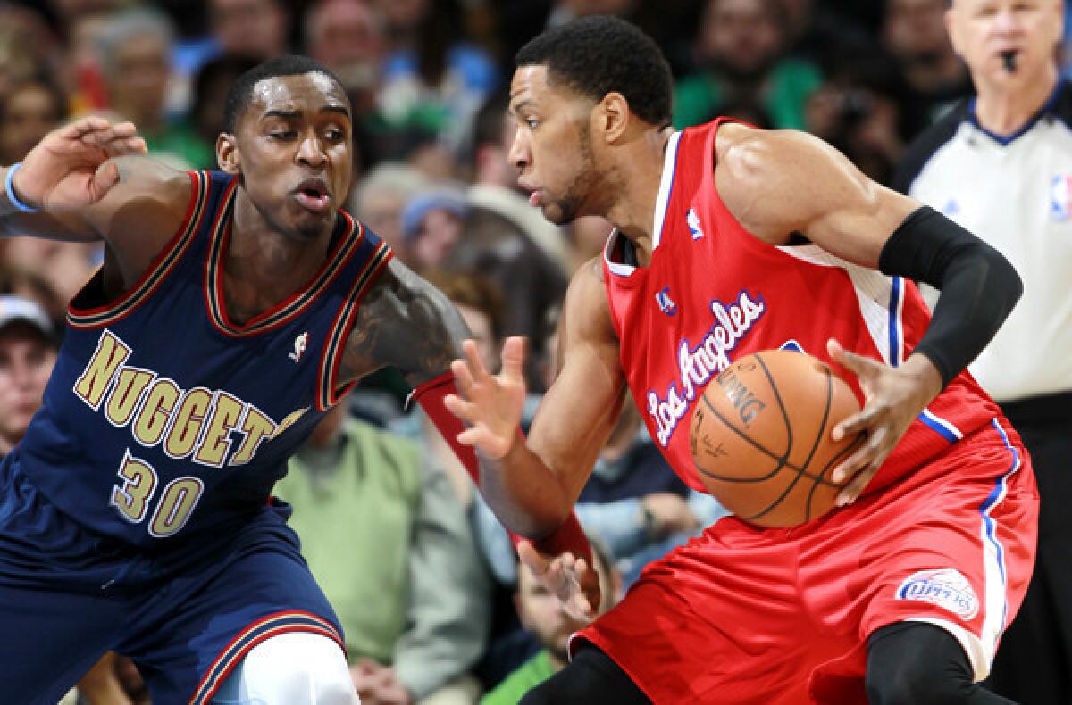 The Clippers' Danny Granger drives against the Nuggets' Quincy Miller during a game in Denver.
