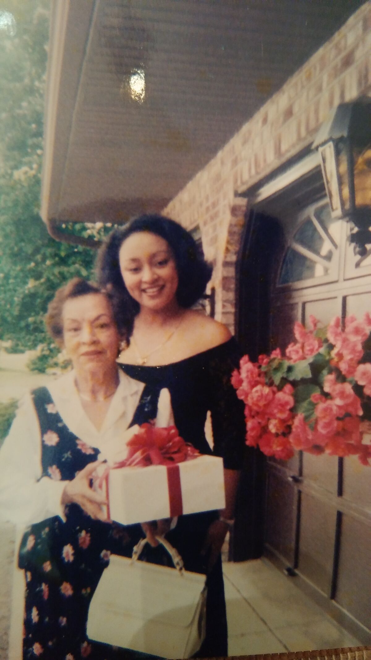 Brigette Simms (right) and her mother Genoveva in an earlier year.