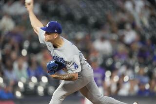 Los Angeles Dodgers starting pitcher Bobby Miller works against the Colorado Rockies during the first inning of the second game of a baseball doubleheader Tuesday, Sept. 26, 2023, in Denver. (AP Photo/David Zalubowski)