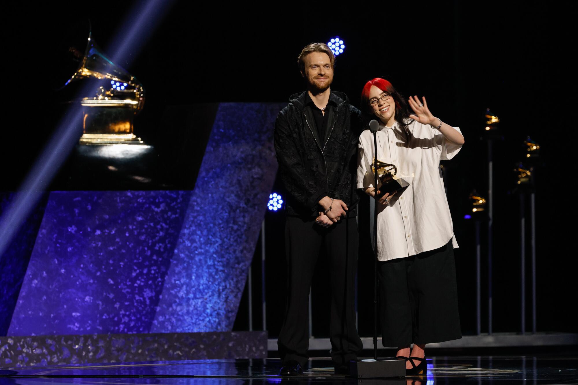 Billie Eilish and Finneas O'Connell accept a Grammy