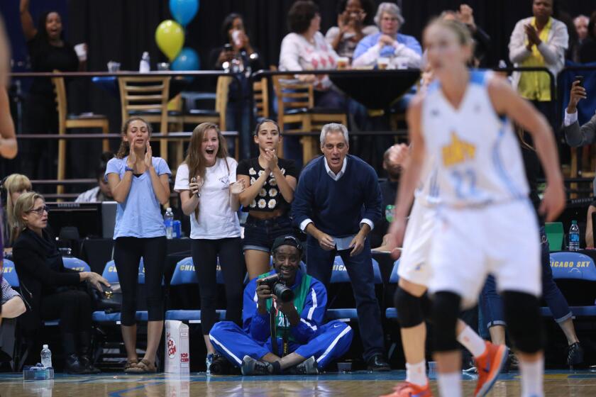 Mayor Rahm Emanuel, his daughters, a family friend, and his wife, Amy Rule, left, cheer on the Chicago Sky.