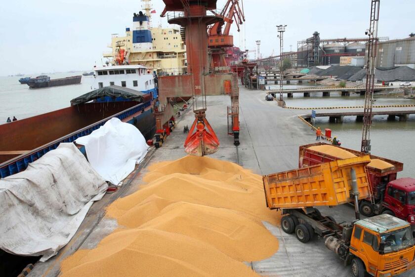 Workers load imported soybeans onto trucks at a port in Nantong in China's eastern Jiangsu province on April 4, 2018. China unveiled plans on April 4 to hit major US exports worth 50 billion USD such as soybeans, cars and small airplanes with retaliatory tariffs in an escalating trade duel between the world's two top economies. / AFP PHOTO / - / China OUT-/AFP/Getty Images ** OUTS - ELSENT, FPG, CM - OUTS * NM, PH, VA if sourced by CT, LA or MoD **