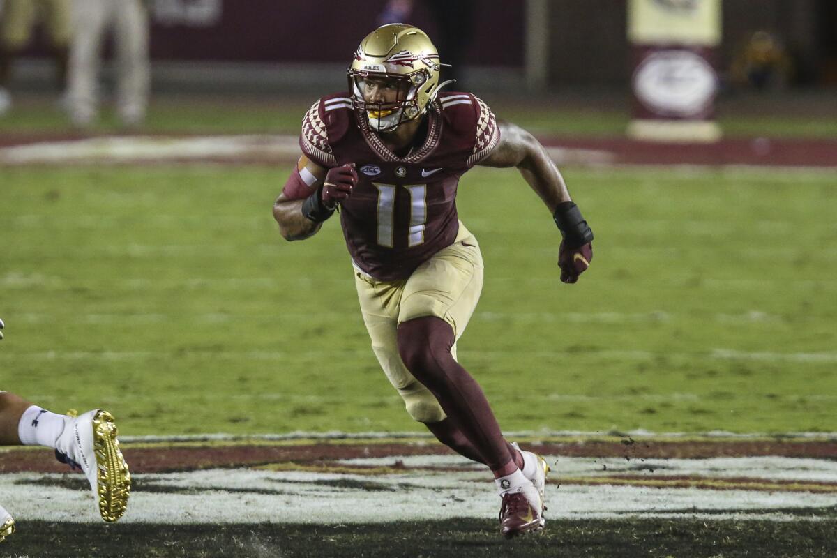 Florida State defensive end Jermaine Johnson II rushes the passer against Notre Dame in December.