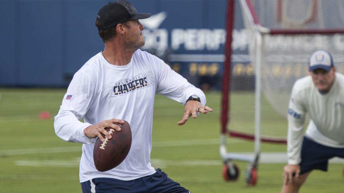 Chargers quarterback Philip Rivers practices on the first day of training at Hoag Performance Center Field in Costa Mesa on May 6.