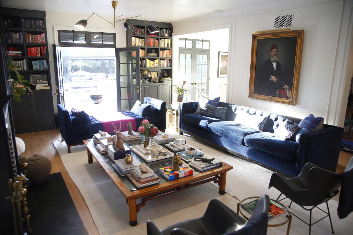 Custom floor-to-ceiling shelves house the couple's many books.