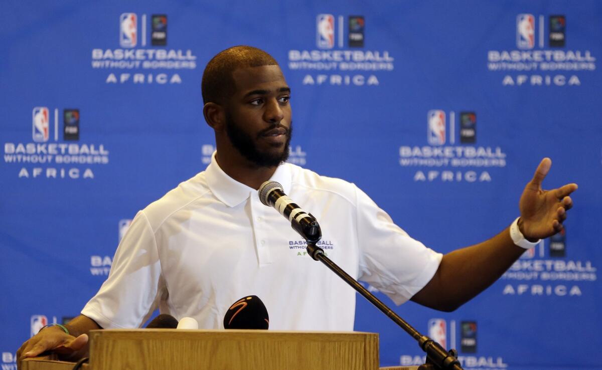 NBA star Chris Paul speaks during a news conference at the American International School in Johannesburg, South Africa.