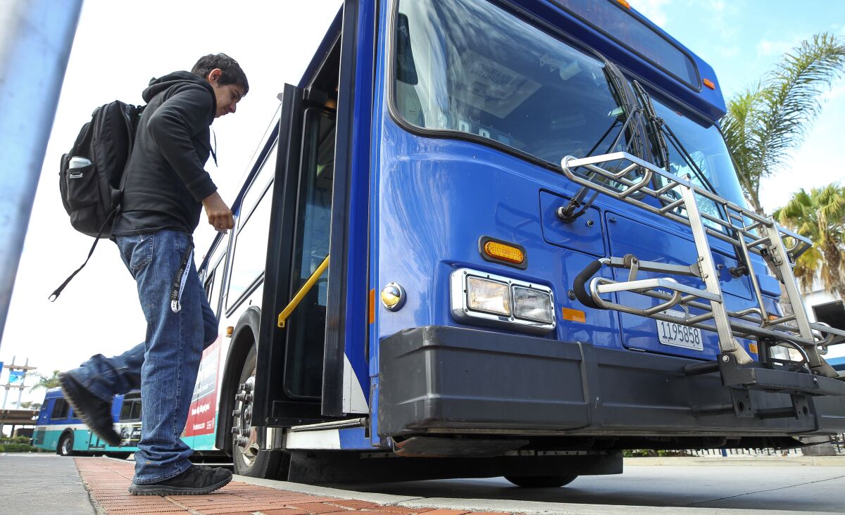 A man gets on a NCTD Breeze bus at the Oceanside Transit Center in Oceanside in 2019.