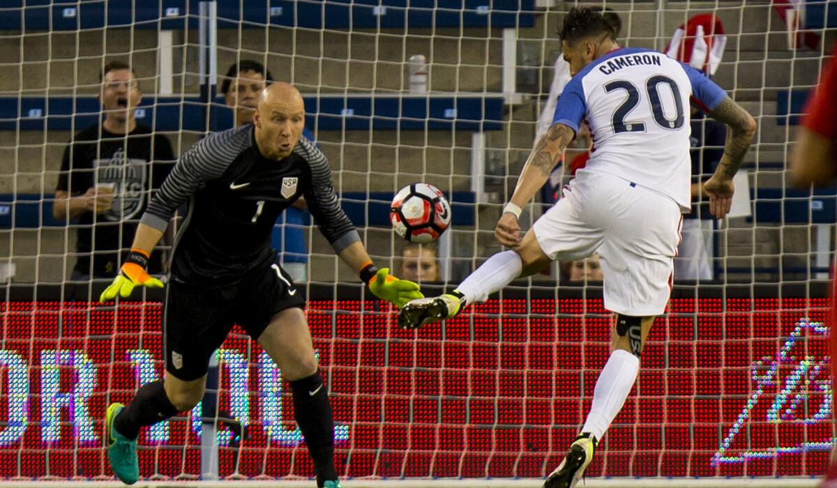 USA's Geoff Cameron, right, knocks the ball away from Brad Guzan after a Bolivia player deflected the ball in the second half of the COPA America Centenario USA 2016 on Saturday.