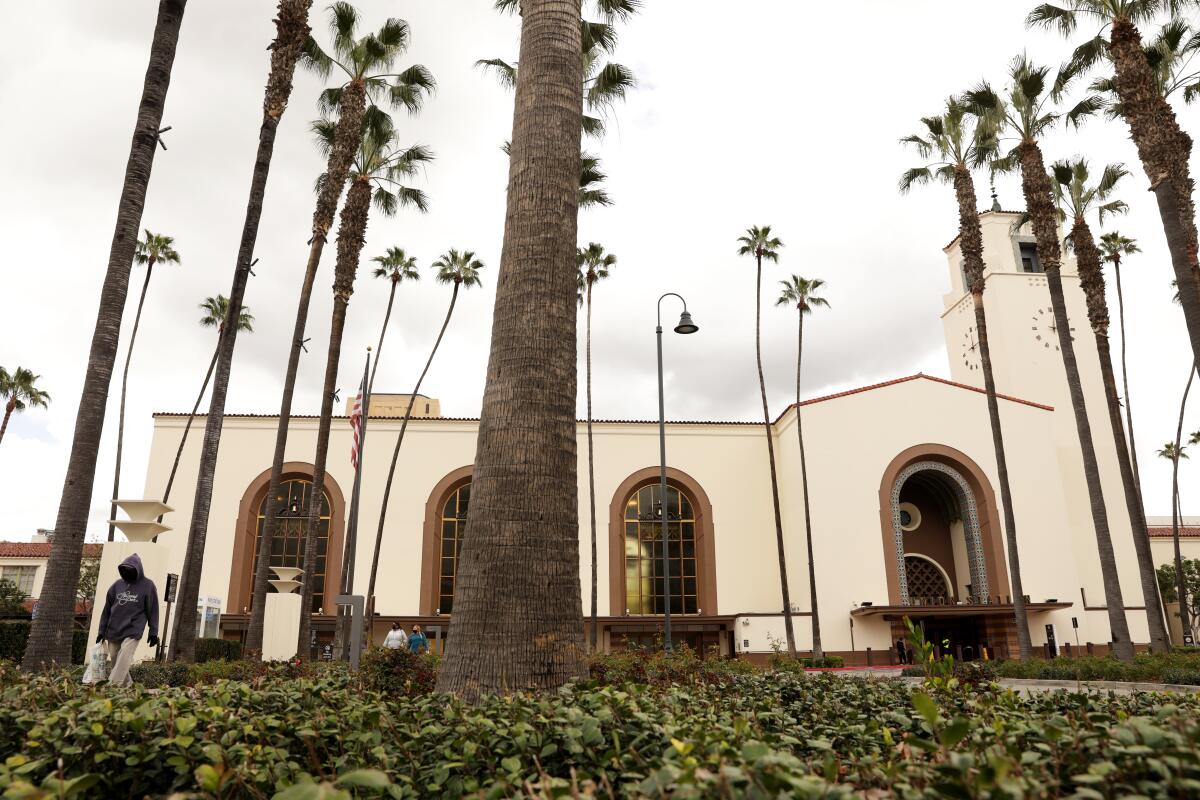 The exterior of Union Station and palm trees.