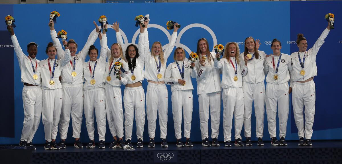 The U.S. Olympic women's water polo team celebrates after winning its third straight gold medal.