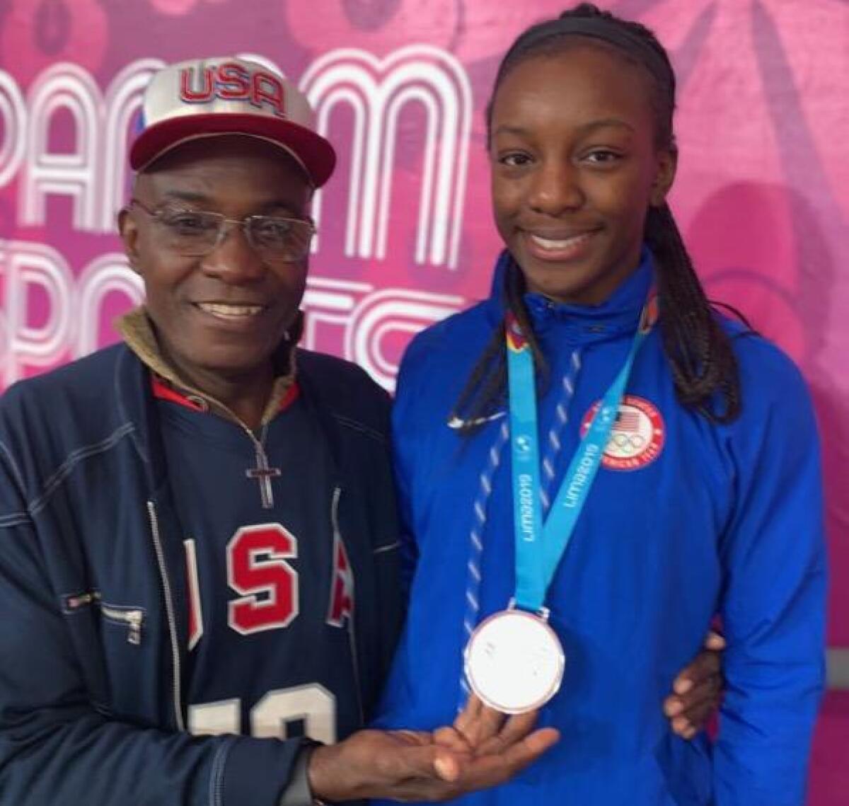 Michaela Onyenwere and her father, Peter, at the Pan Am games this summer in Peru where Michaela helped Team USA to a silver medal.