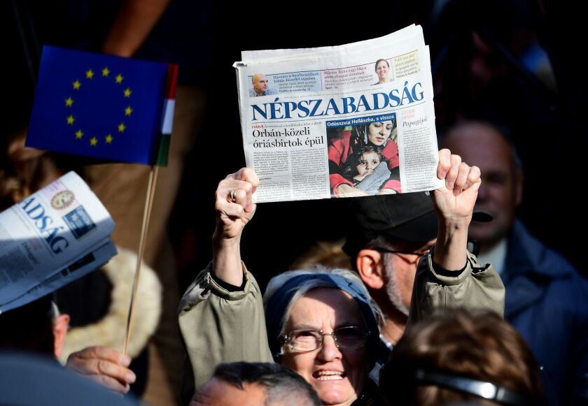 Journalists from Hungary's biggest opposition newspaper, Nepszabadsag, and their supporters protest in Budapest on Oct. 16.