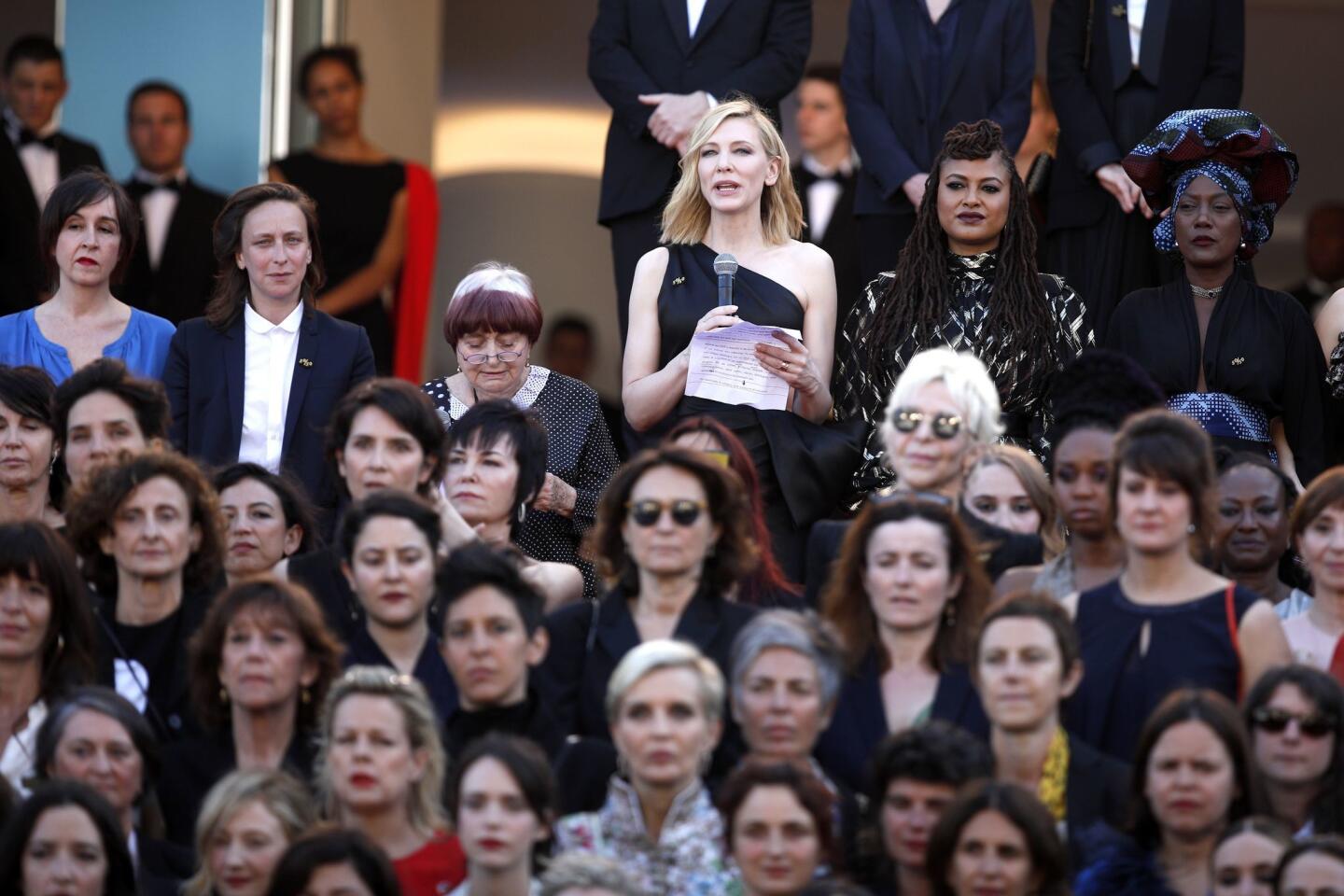 Cate Blanchett, surrounded by other women of film, reads a statement protesting the lack of female filmmakers honored throughout the history of the Cannes Film Festival.