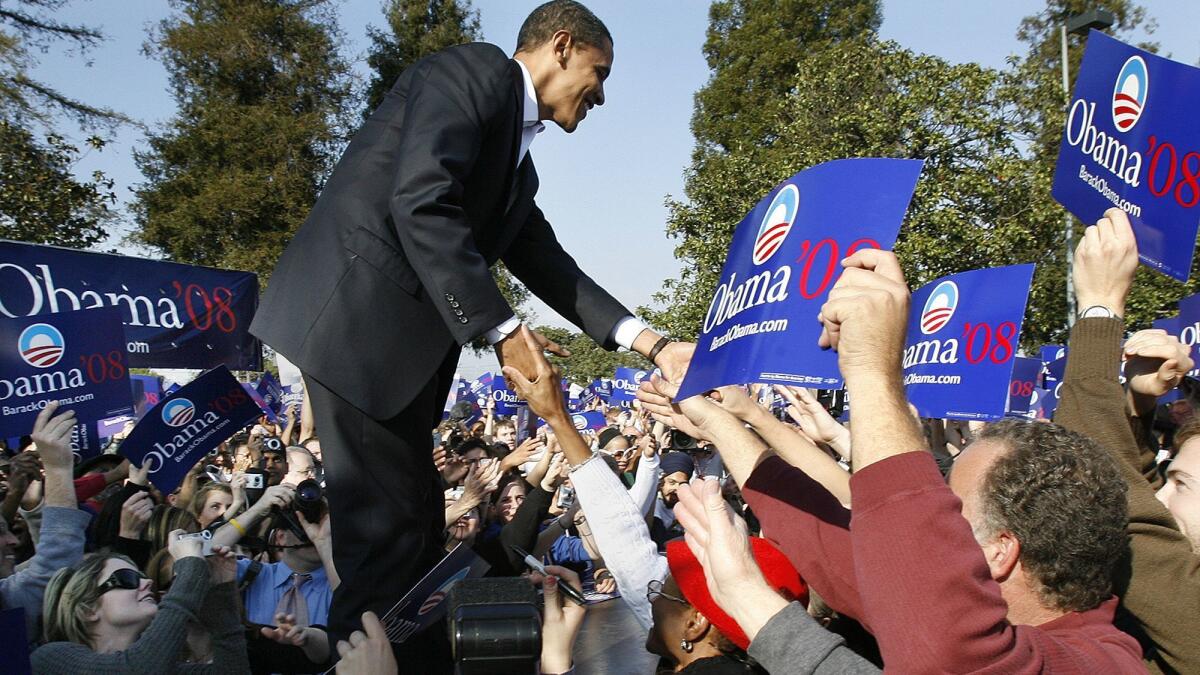 Then-presidential candidate Barack Obama greets supporters during a rally at Rancho Cienega Recreation Center in Los Angeles on Feb. 20, 2007.
