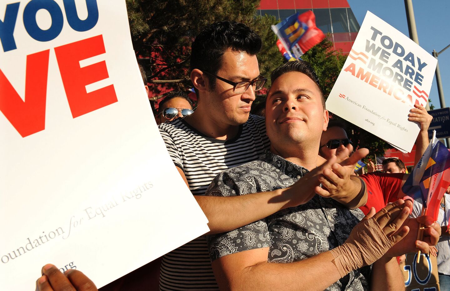 Vincent Cervantes, left, and his partner, Vince Pancucci, embrace during a rally in West Hollywood after the Supreme Court's ruling against Proposition 8.