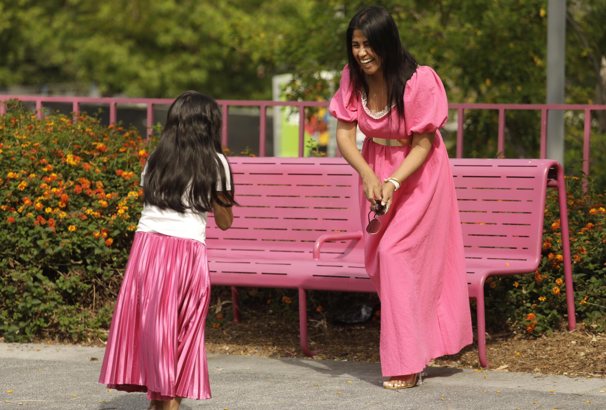 A mother and daughter laugh together