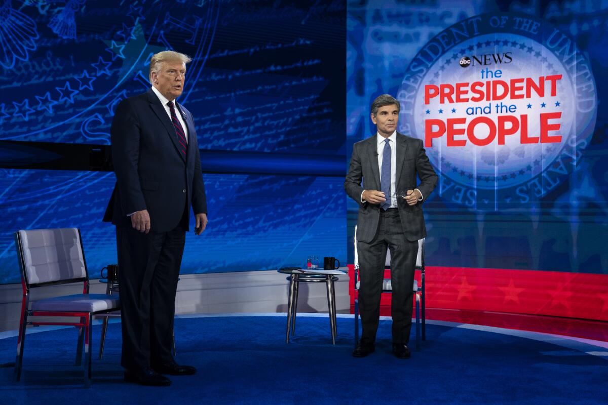 President Trump talks with ABC News anchor George Stephanopoulos before a town hall at National Constitution Center