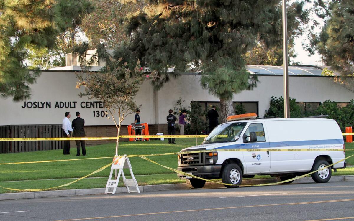 Police investigate the scene where a woman's body was found outside the Joslyn Adult Center in Burbank on Oct. 13.