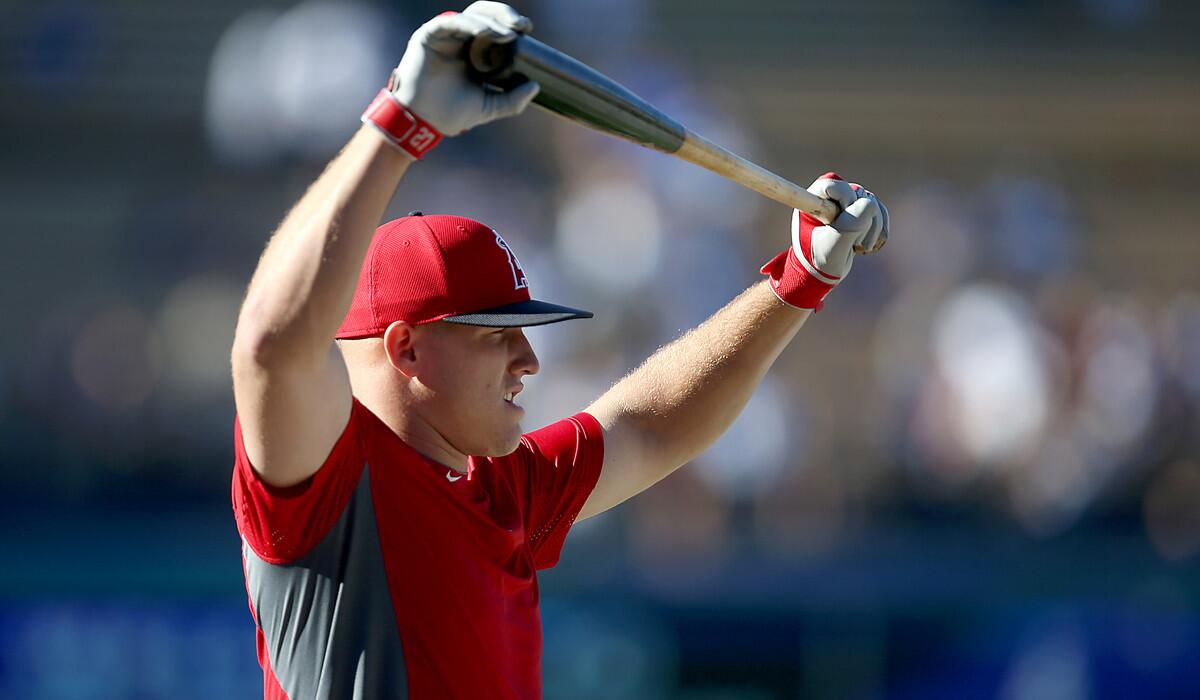 Angels center fielder Mike Trout warms up before the start of an interleague game against the Dodgers.