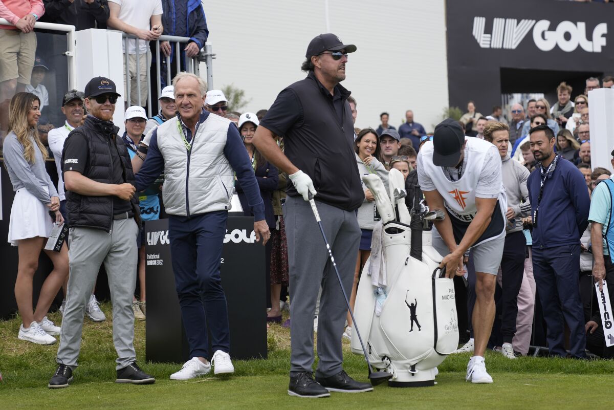 From left, Louis Oosthuizen, LIV Golf CEO Greg Norman and Phil Mickelson at the inaugural LIV Golf Invitational in England.