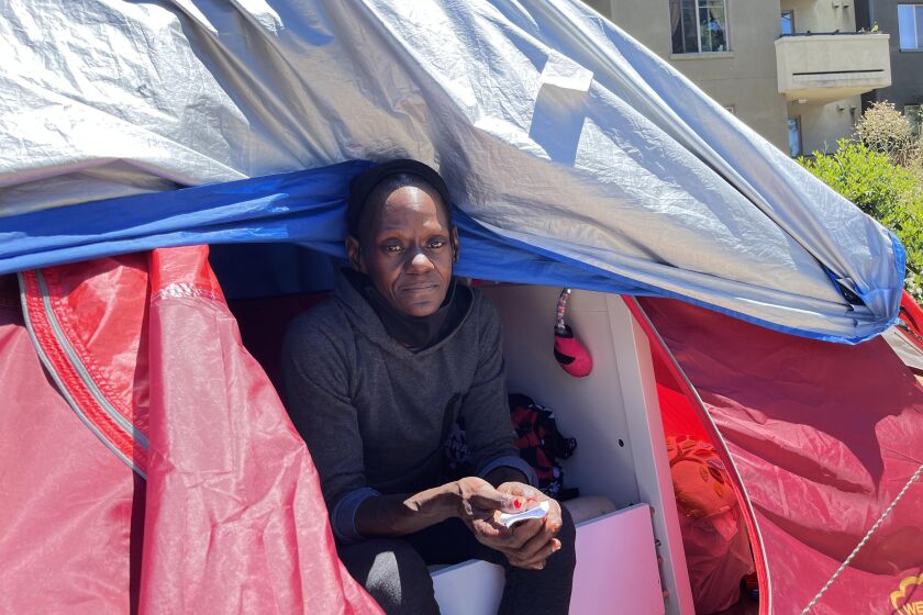 Eugenia Hunter lives in a tent in a bustling Oakland neighborhood.