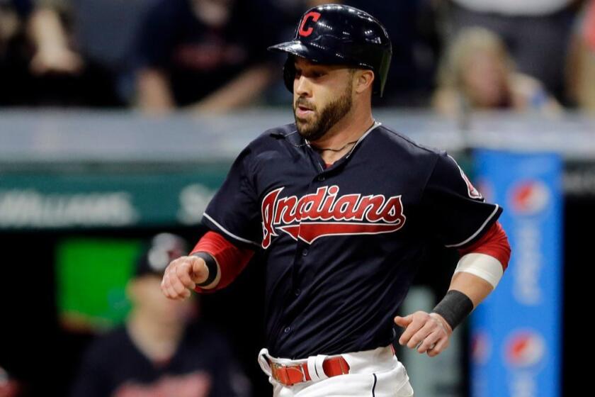 Cleveland Indians' Jason Kipnis scores on a two-run triple hit by Francisco Lindor in the sixth inning of a baseball game against the Detroit Tigers, Friday, July 7, 2017, in Cleveland. (AP Photo/Tony Dejak)