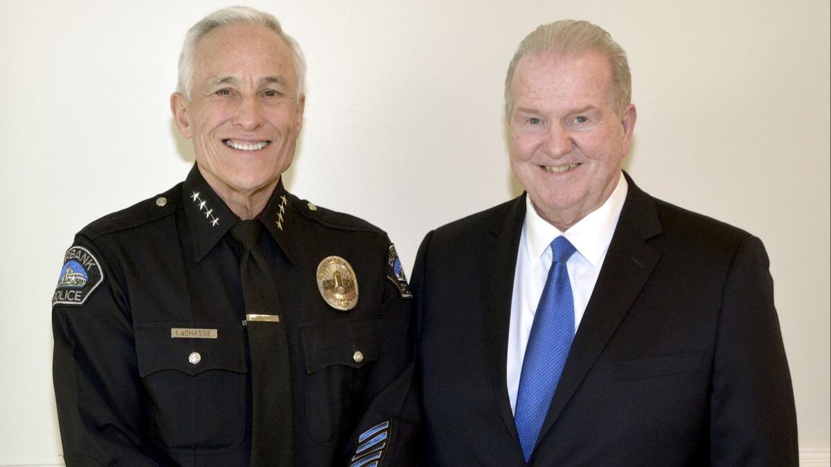Burbank Temporary Aid Center Chairman Roger Koll, right, welcoming Burbank Top Award for Citizenship honoree Police Chief Scott LaChasse to last week's gala.