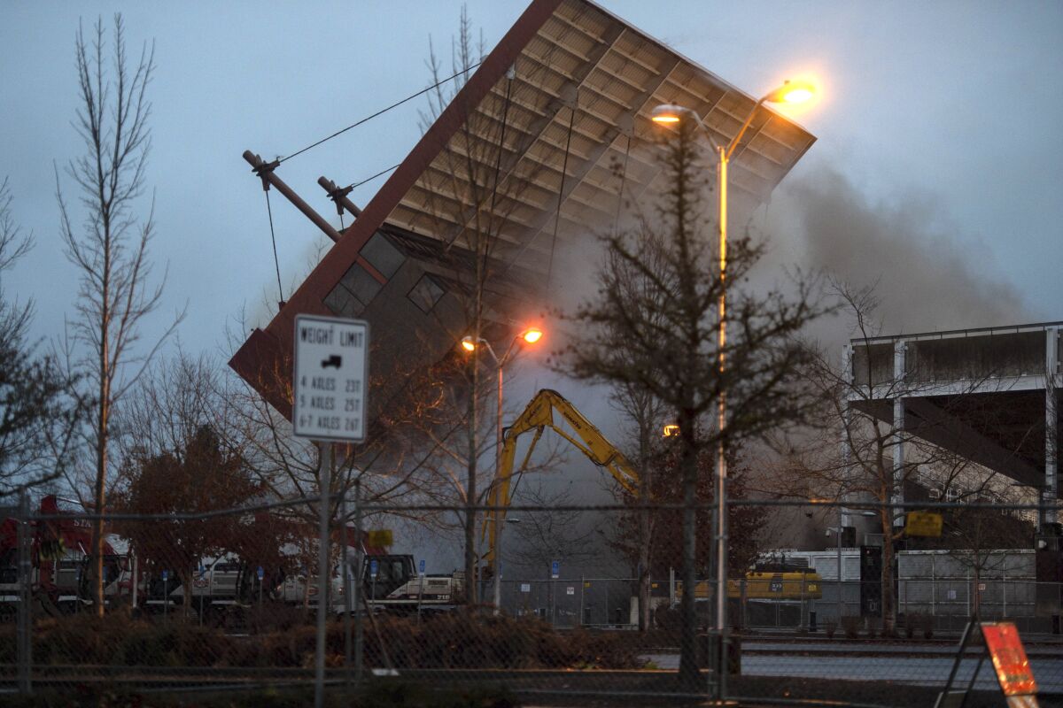 The westside of Oregon State University's Reser Stadium falls during an implosion in Corvallis, Ore., Friday, Jan. 7, 2022. The implosion was part of a $153 million upgrade project that began in 2005. (Kylie Graham/The Corvallis Gazette-Times via AP)