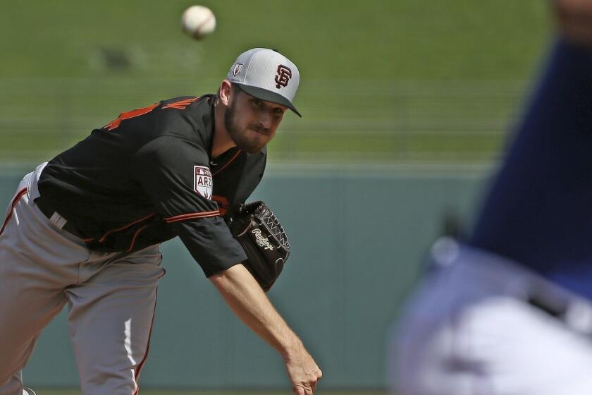 San Francisco Giants starting pitcher Chris Stratton throws a pitch against the Texas Rangers during the first inning of a spring training baseball game Wednesday, March 6, 2019, in Surprise, Ariz. (AP Photo/Ross D. Franklin)