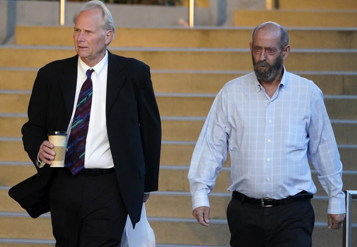 Two men leave a courthouse in Los Angeles in Los Angeles in October 2023.