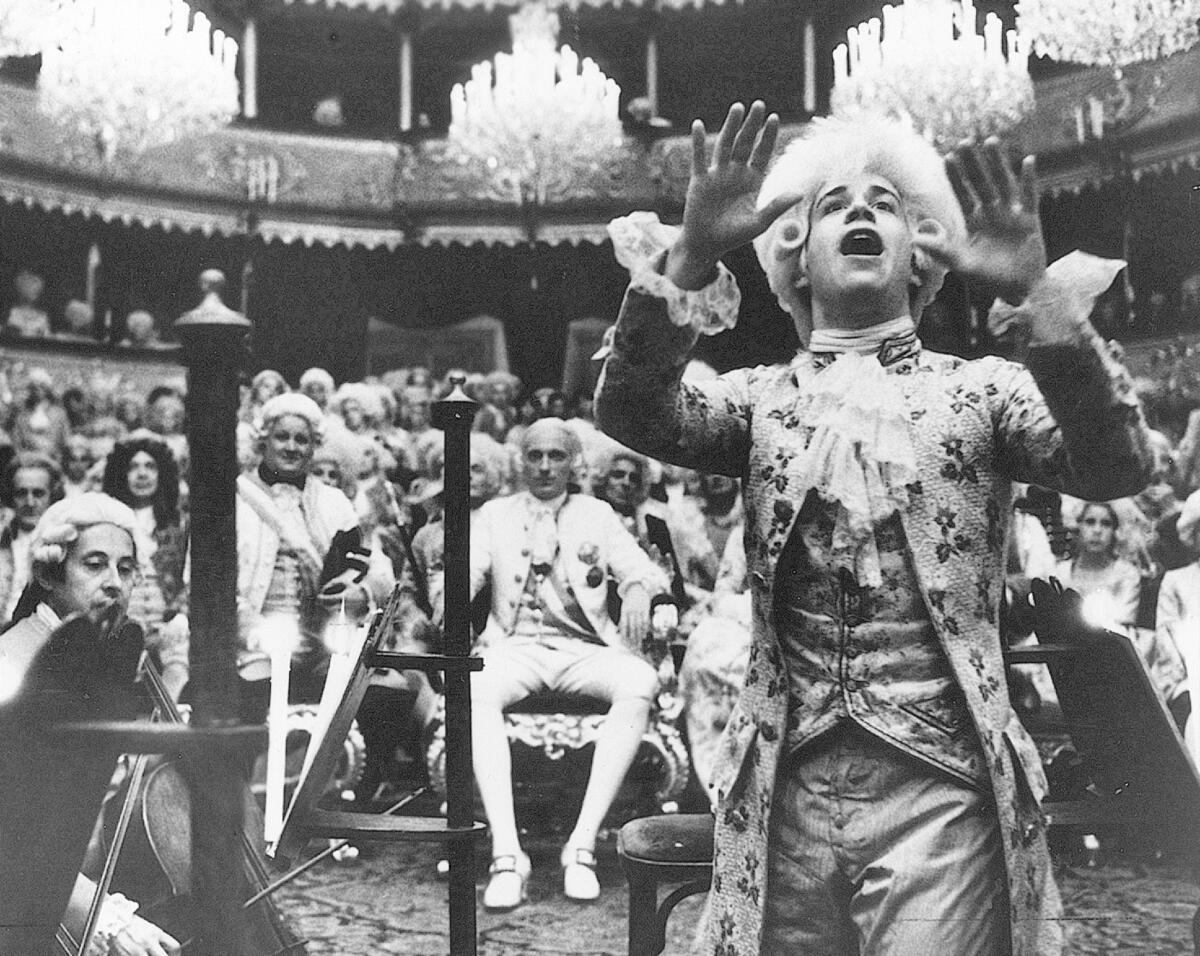 Tom Hulce, right, as Wolfgang Amadeus Mozart in the movie “Amadeus.” 