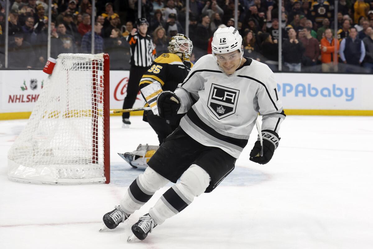 Kings forward Trevor Moore celebrates after scoring the winning goal past Boston Bruins goaltender Linus Ullmark.