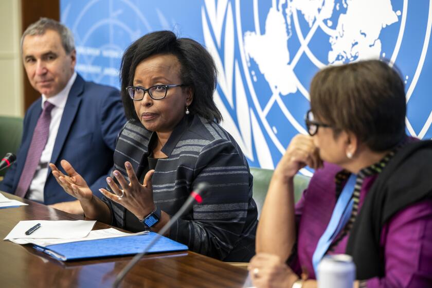 FILE - Steven Ratner, left, Expert, Kaari Betty Murungi, center, Chair of the International Commission of Human Rights Experts on Ethiopia, and Radhika Coomaraswamy, Expert, right, speak about the presentation of the first report of the International Commission of Human Rights Experts on Ethiopia during a press conference at the European headquarters of the United Nations in Geneva, on Sept. 22, 2022. A U.N.-backed probe of human rights abuses in Ethiopia is set to expire after no country stepped forward to seek an extension, despite repeated warnings that serious violations continue almost a year after a cease-fire ended a bloody civil war in the East African country. (Martial Trezzini/Keystone via AP, File)