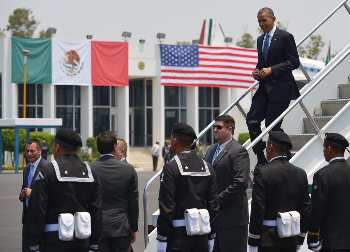 President Obama steps off Air Force One upon arrival Thursday at Benito Juarez International Airport in Mexico City.