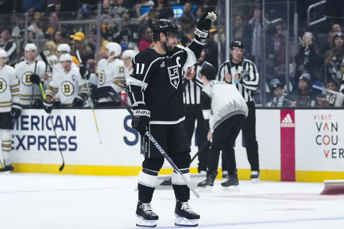 Kings captain Anze Kopitar acknowledges cheers and applause from fans and players at Crypto.com Arena.