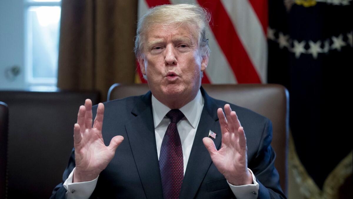 President Trump speaks to reporters in Washington on Jan. 23.