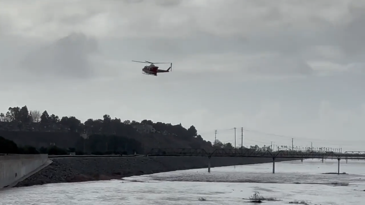 An Orange County Fire Authority helicopter looks for a potential victim.