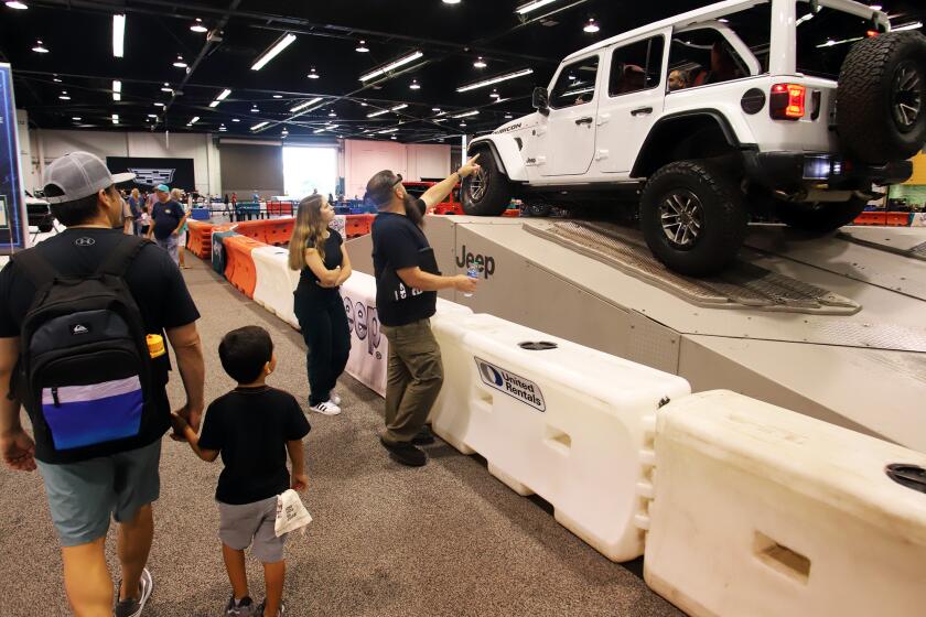 Auto show attendees watch as guests get a chance to test drive a Jeep Rincon on the off-road track during the OC Auto Show at the Anaheim Convention Center in Anaheim on Thursday, October 5, 2023. (Photo by James Carbone)