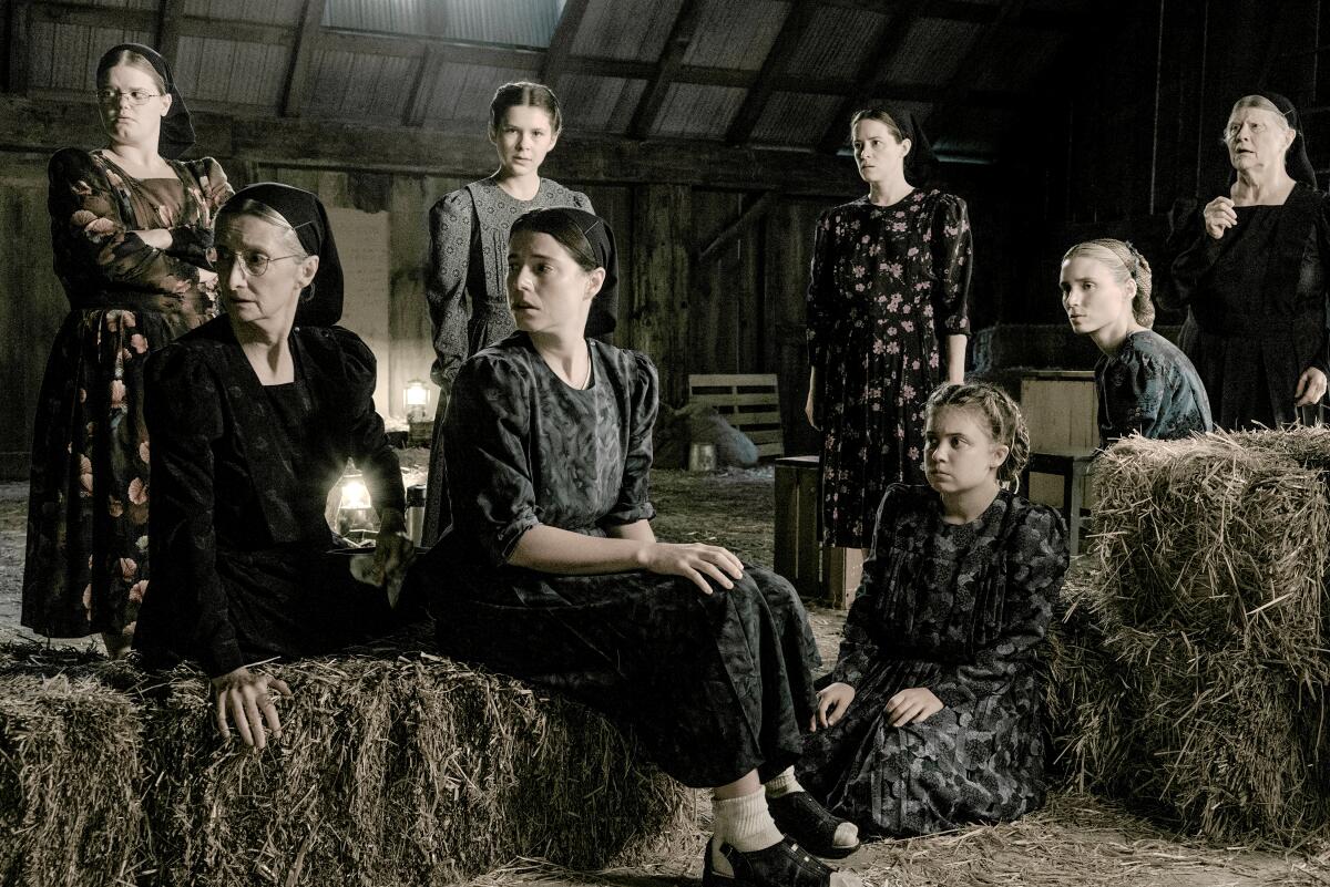 A scene from "Women Talking" in which the women gather in a barn to make a critical decision.