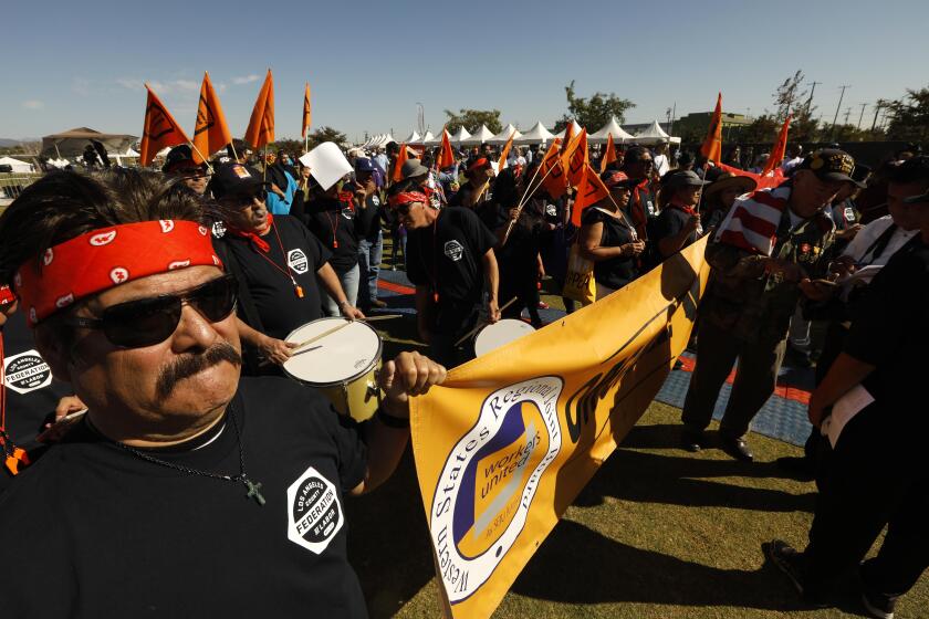LOS ANGELES, CA - NOVEMBER 9, 2019 - - Eliseo Ligorea, left, with Los Angeles County Federation of Labor AFL-CIO, joins hundreds who attend the, “Rally for Justice Immigrant Rights and Equality - 25 years beyond Proposition 187,” at the Los Angeles State Historic Park in Los Angeles on November 9, 2019. State Senator Maria Elena Durazo, U.S. Congresswoman Lucille Roybal Allard, Los Angeles Mayor Eric Garcetti, and many members of Los Angeles City Council spoke at the rally. Prop. 187 aimed to block undocumented immigrants from using non-emergency health care, public education and other services in the State of California. Federal courts denied it from ever being implemented. (Genaro Molina / Los Angeles Times)