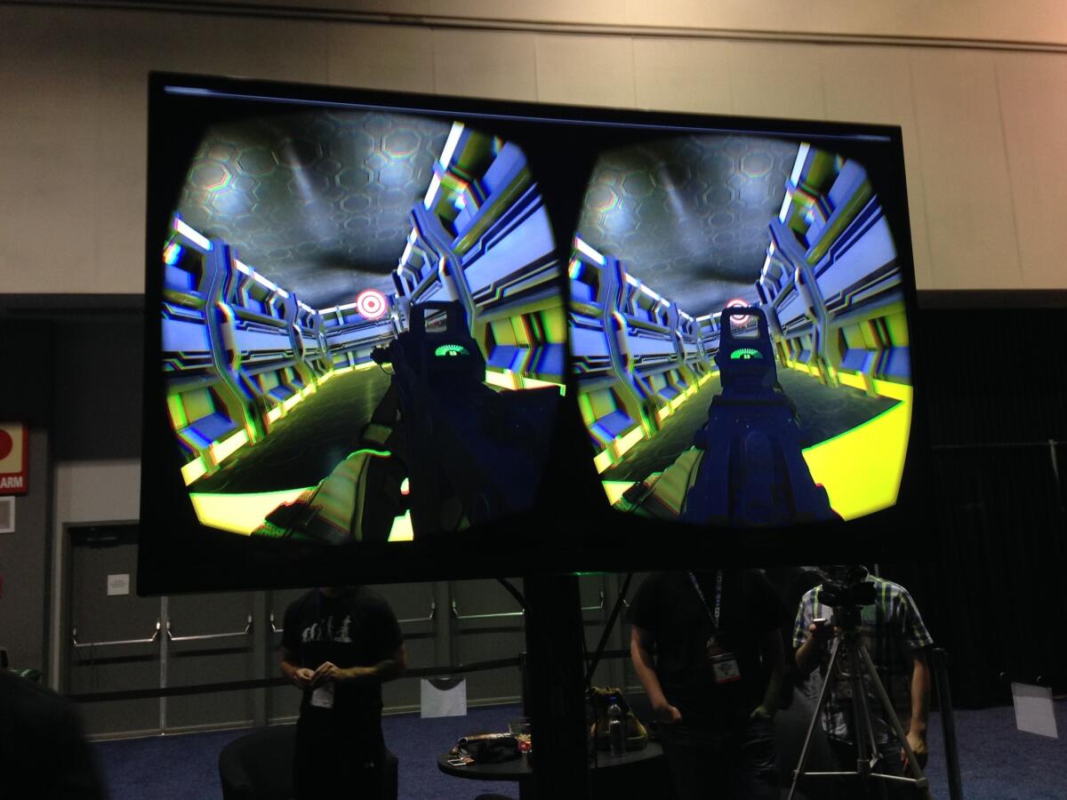 A screen shows the video playing inside the goggles of an Omni user, from the company Virtuix, on display at the Electronic Entertainment Expo.