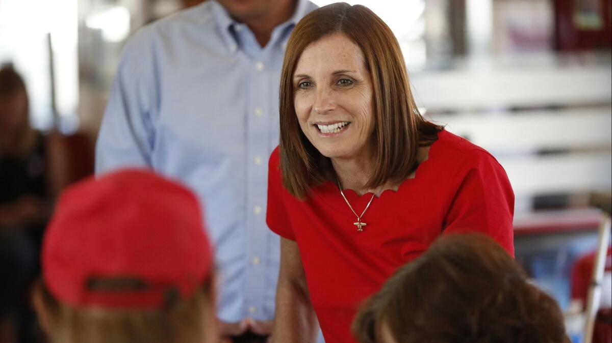 Martha McSally speaks with voters at Chase's diner in Chandler, Ariz., on Nov. 6.
