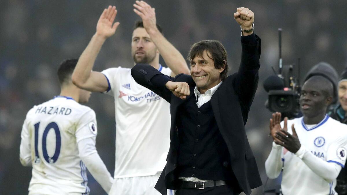 Antonio Conte celebrates with Chelsea players after a victory over Crystal Palace on Dec. 17.