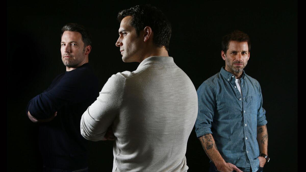 Actors Ben Affleck, left, Henry Cavill and director Zack Snyder.