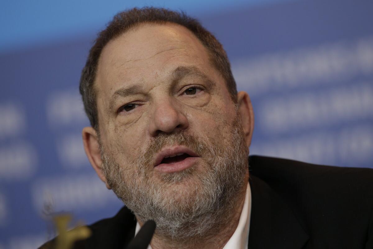 Weinstein Co. co-founder Harvey Weinstein speaks during a press conference for the film "Woman in Gold." The company plans to lay off 40 to 50 people next week.