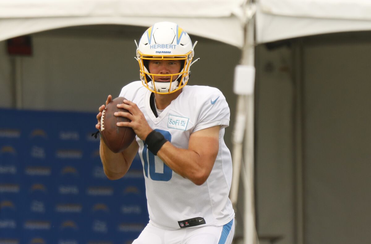 Chargers quarterback Justin Herbert looks to pass in practice.