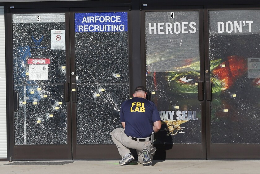 An FBI investigator at the scene of a shooting outside a military recruiting center in Chattanooga, Tenn., in July.
